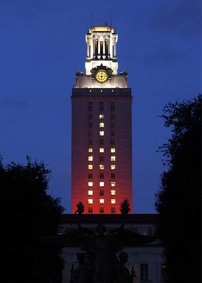 UT's iconic tower lit up at dusk during the blue hour