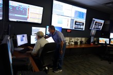 Technicians monitoring automated building systems