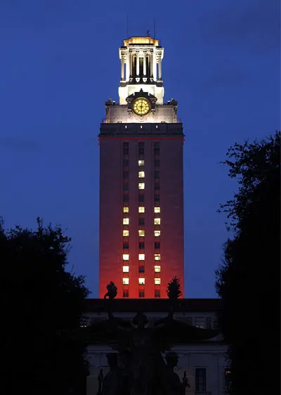 UT's iconic tower lit up at dusk during the blue hour