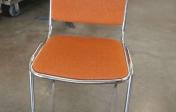 Padded non-folding orange chair