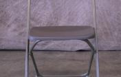 Plastic gray folding chair