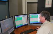 FOM team member monitoring alarms on lcd displays