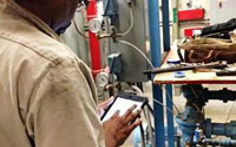 Technicians use hand-held devices to connect to the work order system remotely